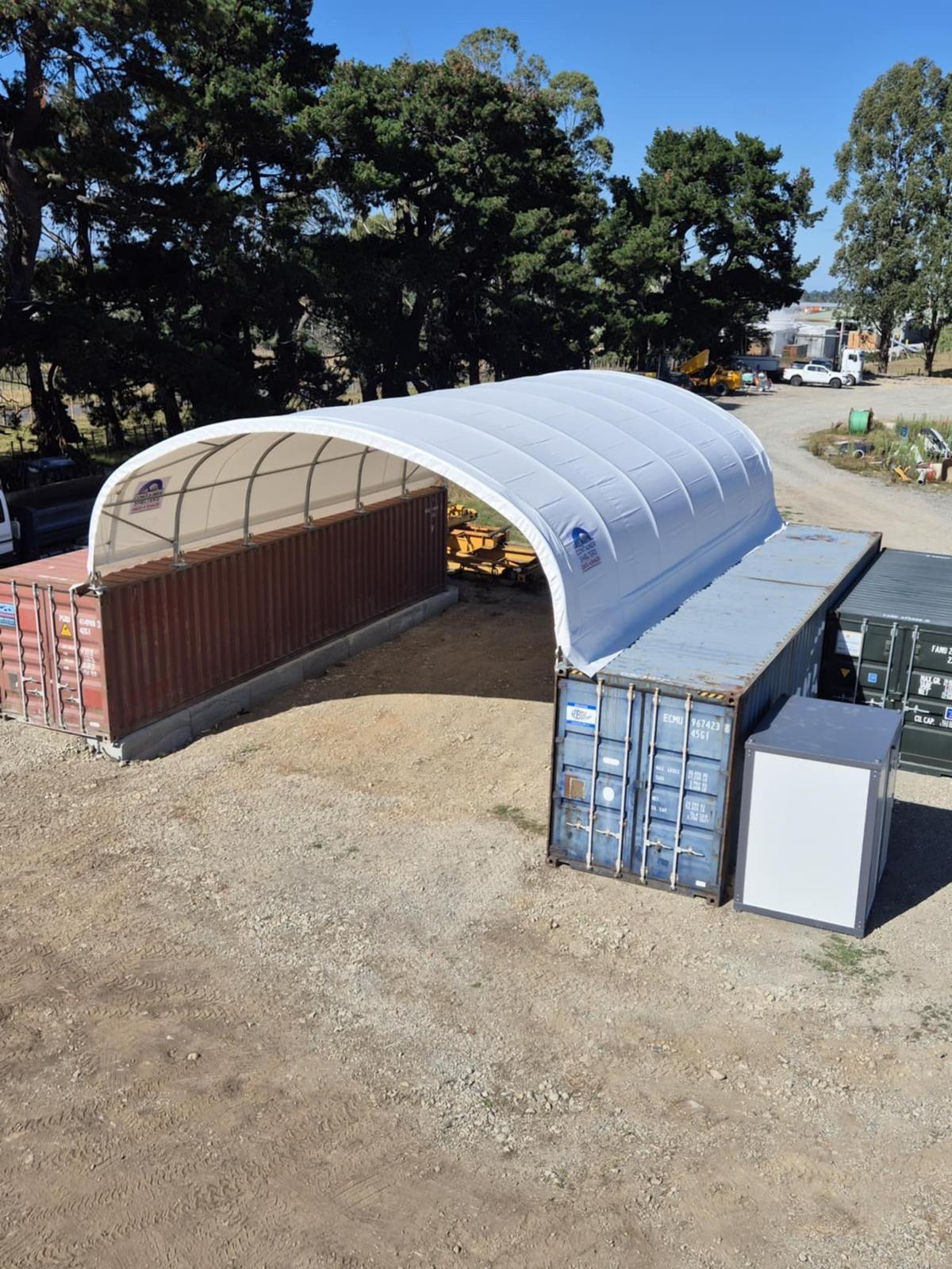 8m x 40ft container shelter with open ends on a farm