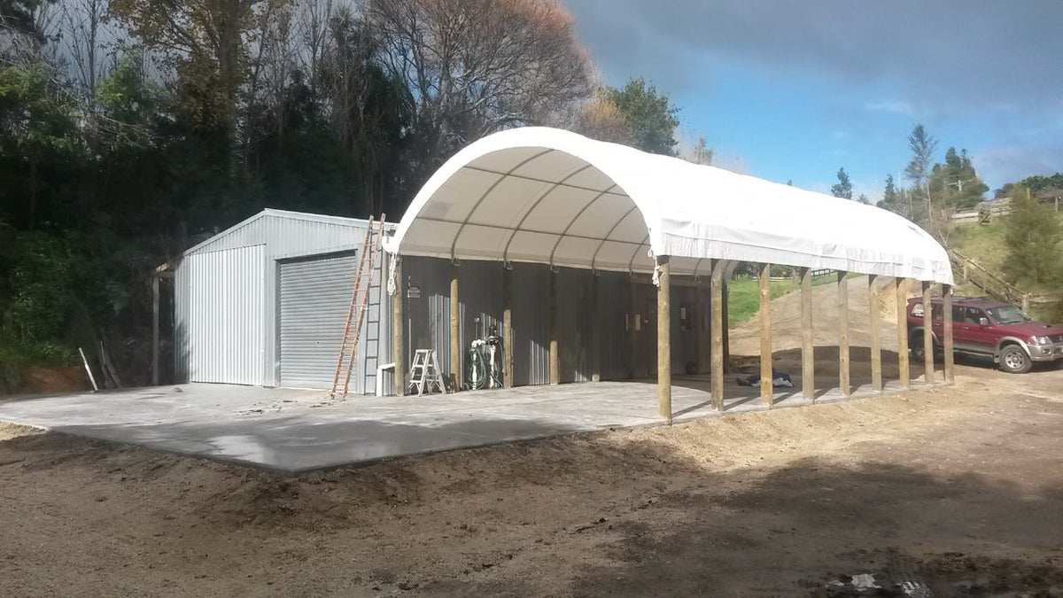 6m x 40ft shelter mounted on timber posts at a manufacturing site