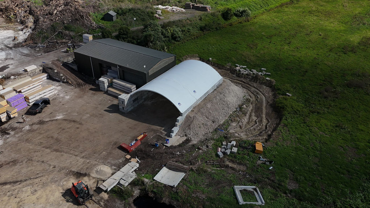 12m x 60ft container shelter on concrete blocks at a waste site