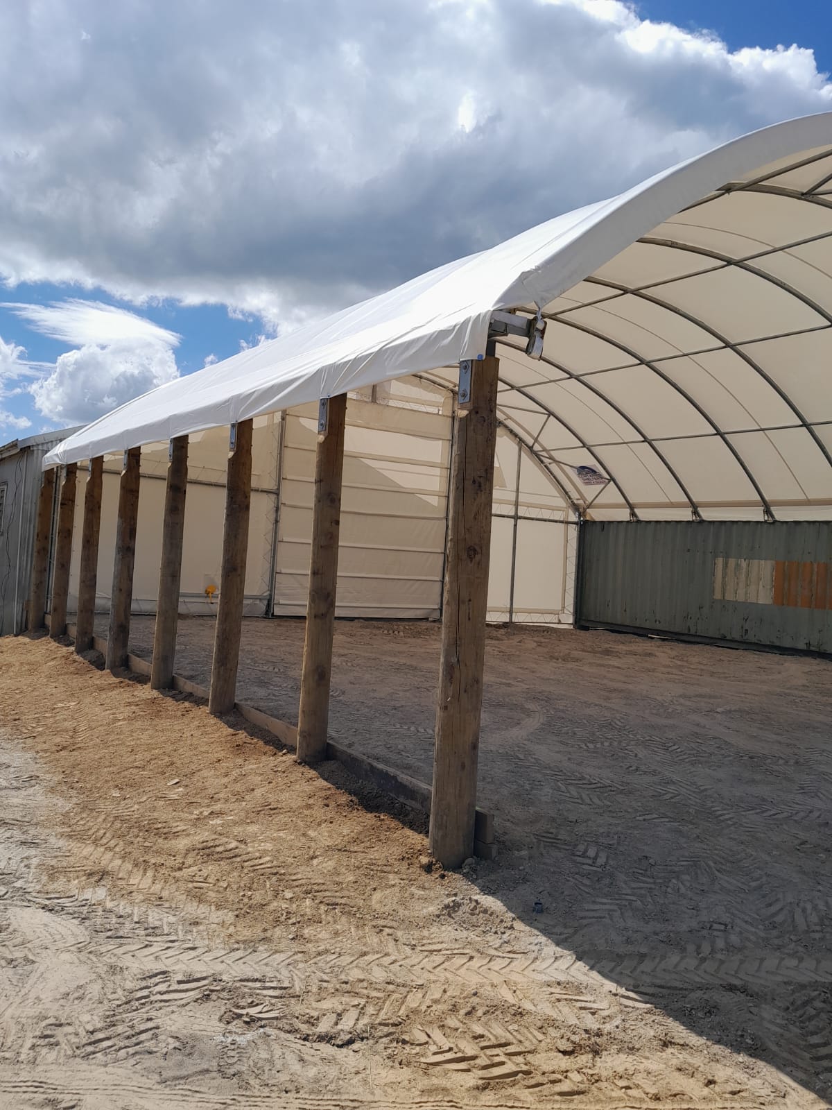 Container shelter on a combined post and container mount