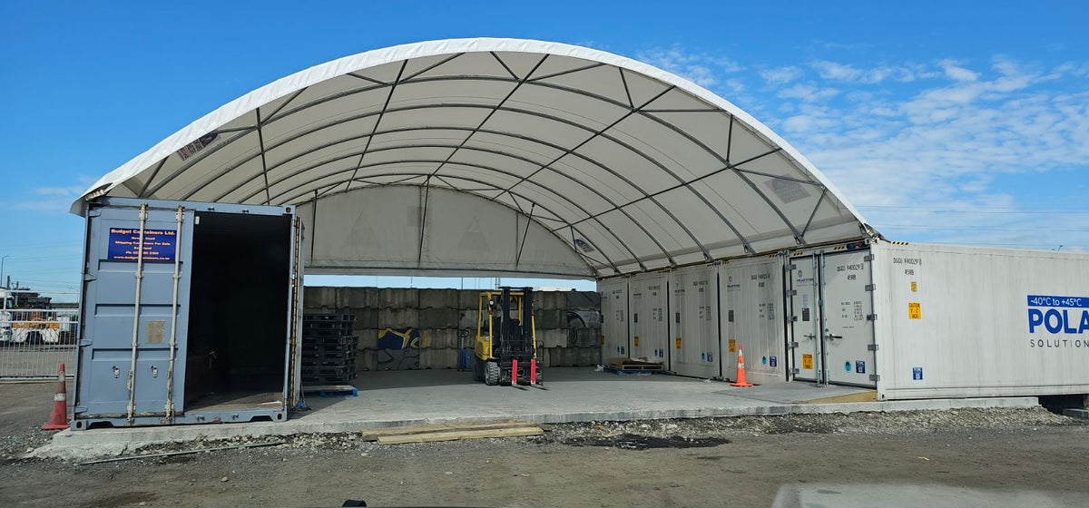Container shelter over refrigeration containers at a transport operation
